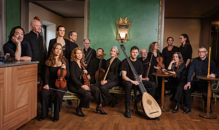 Musicians standing in a row. Photo.