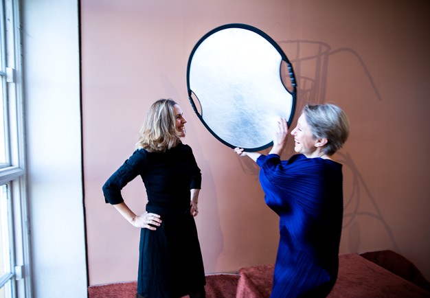 Portrait of two women, laughing. Black and white photo.