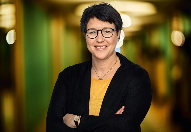 Close-up. Emma looks happy and is smiling. Photography.