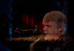 Man playing sax. Photo.