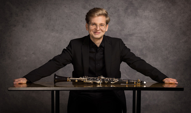 Photo of a man dressed in black.